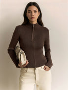 Ribbed zip-up knit cardigan jacket with high neckline and fitted cuffs