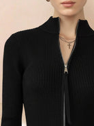 Black ribbed zip-up knit cardigan jacket with high neckline and fitted cuffs