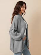 Oversized button-front knit cardigan with balloon sleeves and gold-tone buttons