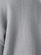 Oversized button-front knit cardigan with balloon sleeves and gold buttons in chunky polyester knit