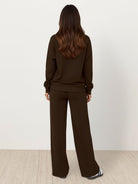 Wrinkle-free two-piece casual polo set with quarter-button top and high-waisted pants