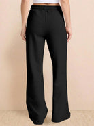 Wrinkle-free polo set with quarter-button top and high-waisted pants in breathable fabric