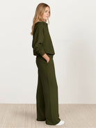 Wrinkle-free casual two-piece polo set with structured breathable fabric and high-waisted pants