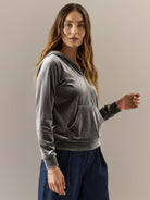 Ultra-soft velvet half-zip hoodie with kangaroo pocket and relaxed tunic fit