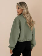 Cropped textured baseball jacket with full-zip, stand collar, elastic cuffs and waistband, styled for casual wear.