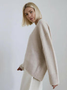 oversized crew neck knit sweater with drop shoulders and ribbed cuffs in neutral color