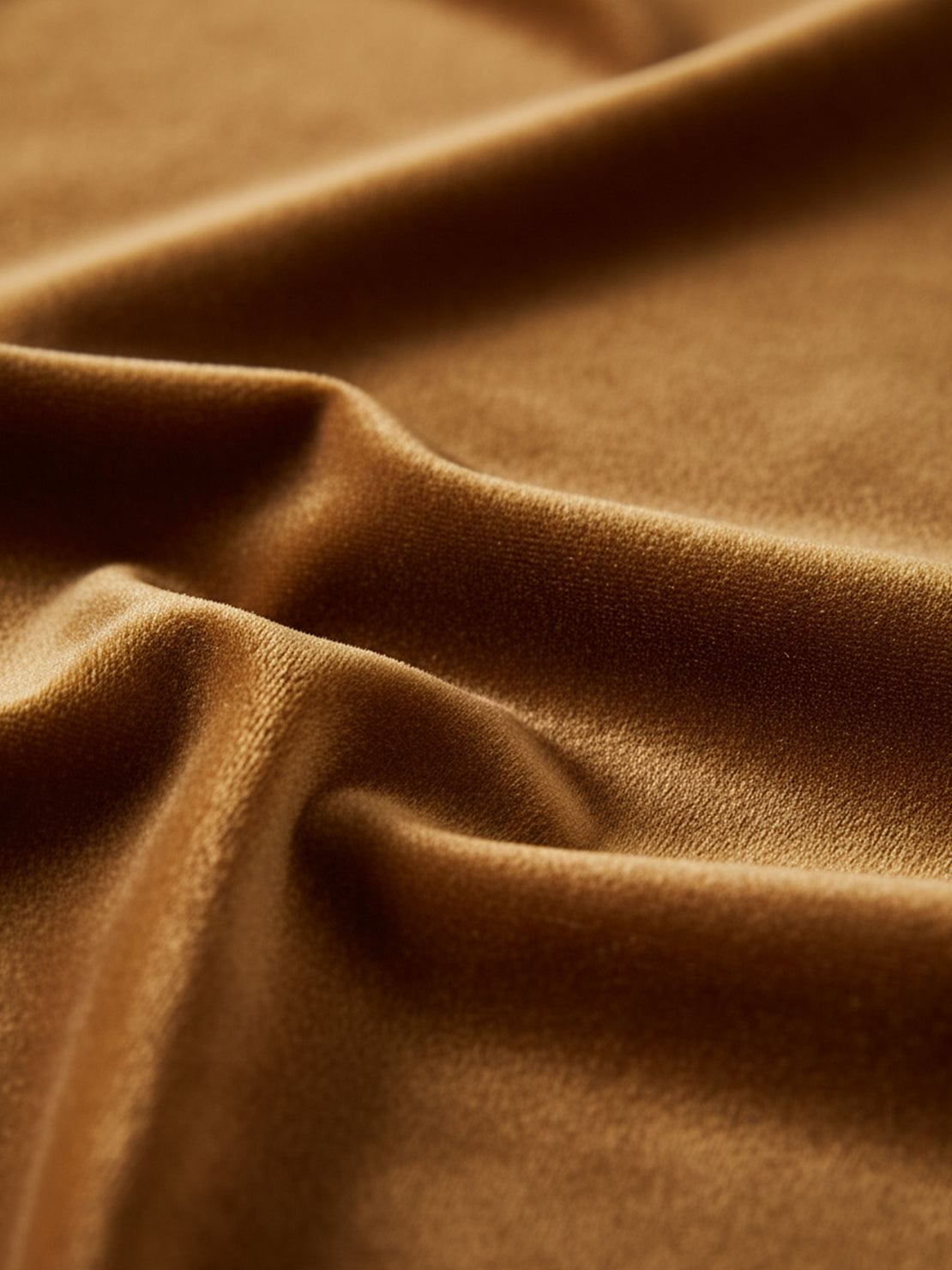 Woman wearing deep V-neck velvet suit with long sleeves and wide-leg pants