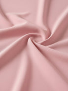 White pleated V-neck long-sleeve blouse with button cuffs and relaxed fit