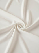 White pleated V-neck long-sleeve blouse with button cuffs and relaxed fit