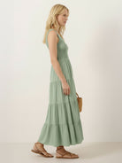 Smocked sleeveless maxi dress with tiered skirt and scoop neckline in lightweight fabric