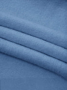 Oversized cable-knit crewneck sweater with dropped shoulders and ribbed trim in thick plush fabric