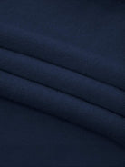 Oversized cable-knit crewneck sweater with dropped shoulders and diamond rope pattern, thick plush fabric for cold weather layering