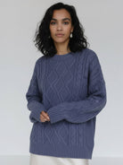 Oversized cable-knit crewneck sweater with dropped shoulders and ribbed trim in thick plush fabric