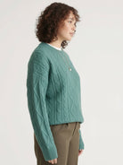 Oversized cable-knit crewneck sweater with dropped shoulders and ribbed trim in thick plush fabric