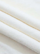 Oversized cable-knit crewneck sweater with dropped shoulders and ribbed trim in thick, plush fabric