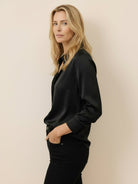 Silk-finish button front shirt with relaxed fit and smooth fabric drape