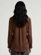 silk-finish button front shirt with smooth fabric and relaxed fit on hanger