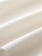 White 100% Merino Wool short-sleeve mock neck tee with slim fit and breathable fabric