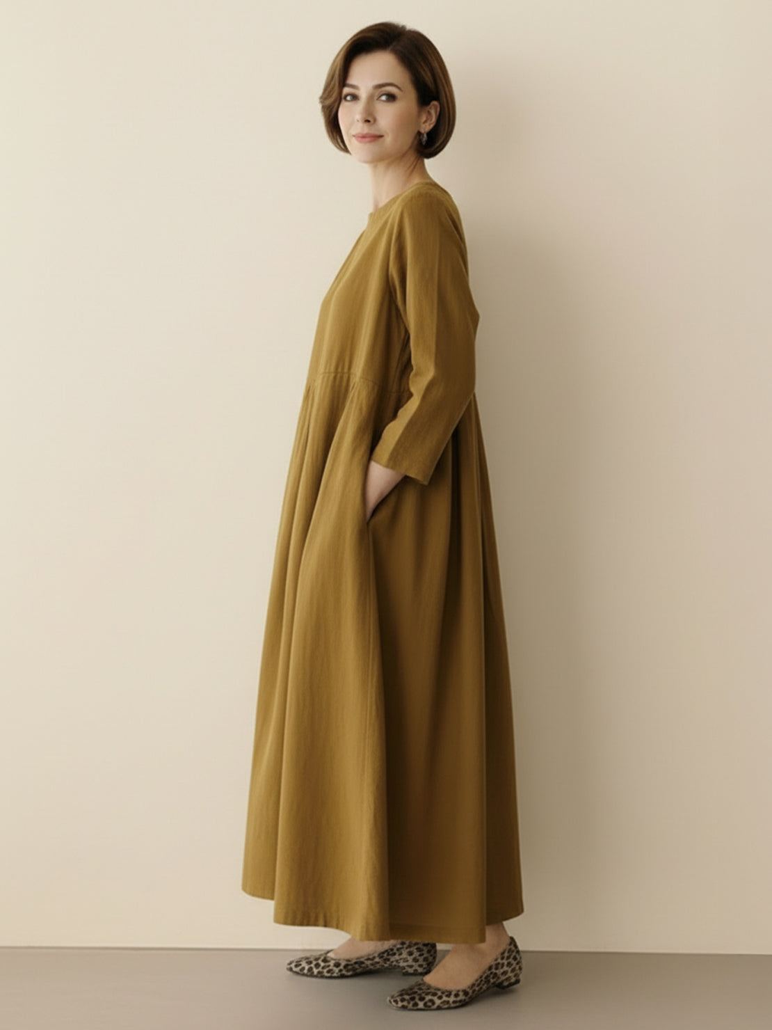 Cotton-linen empire waist dress with natural crinkle texture and deep pockets