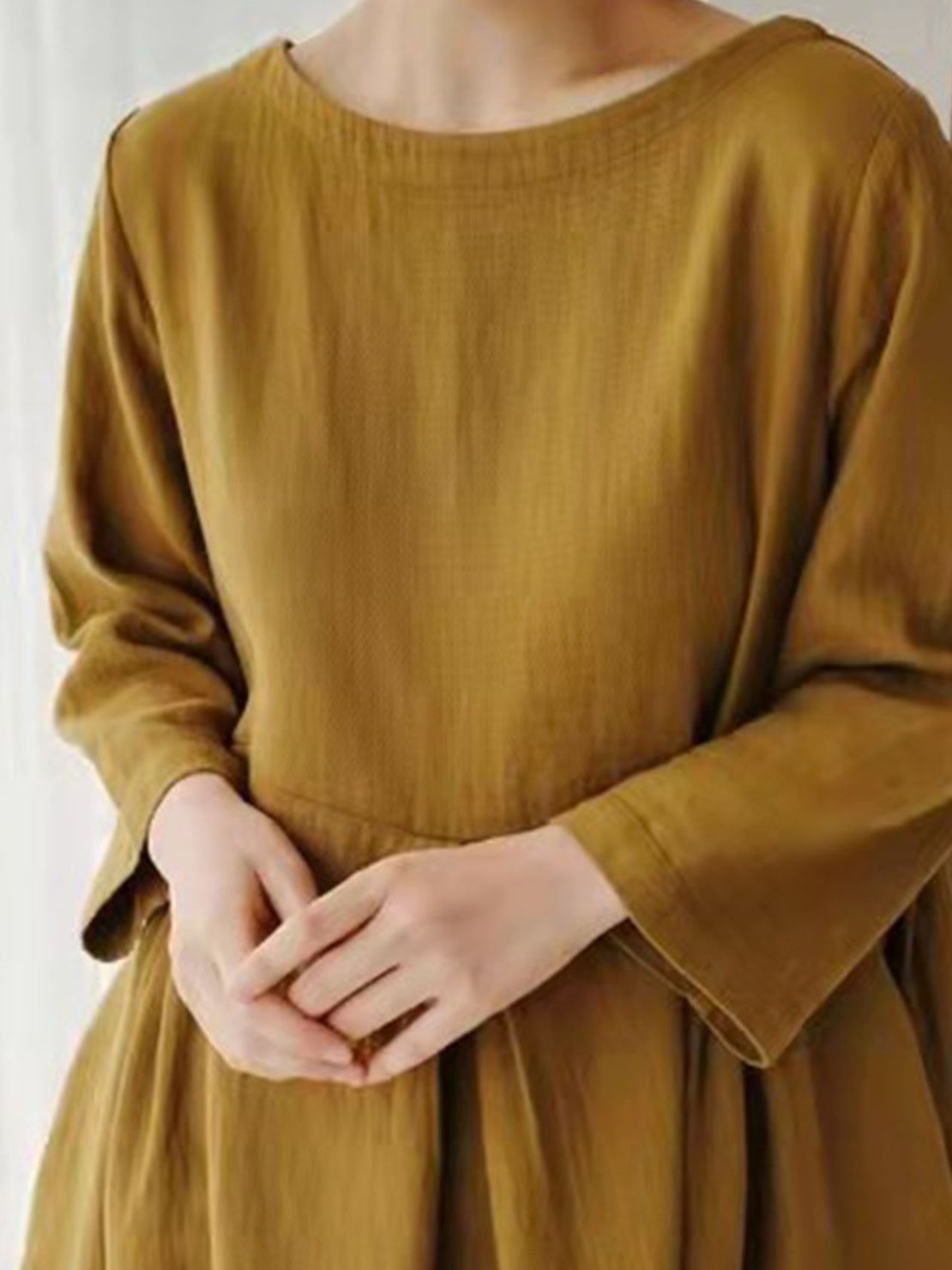 Lightweight cotton-linen empire waist dress with natural crinkle texture and deep side pockets