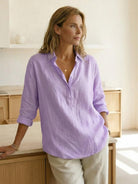 100% cotton popover blouse with relaxed fit, classic collar, and tunic length in natural crinkle texture