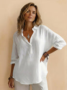 Lightweight 100% cotton popover blouse with classic collar and relaxed oversized fit.