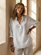 100% cotton popover blouse with relaxed fit and crinkle texture
