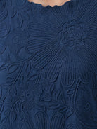 Floral Jacquard Pleated Top with 3D floral texture, flutter sleeves, and relaxed A-line silhouette