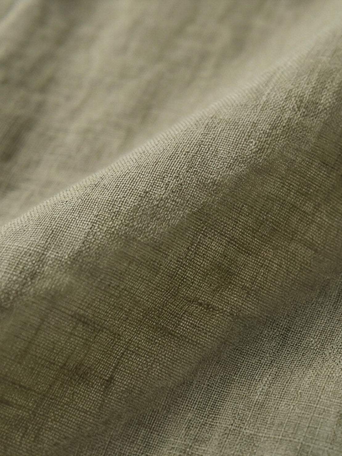 Lightweight 100% linen sheer overshirt with relaxed fit and button front