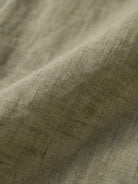 Lightweight 100% linen sheer overshirt with relaxed fit and button front