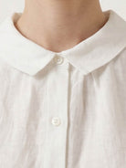 100% linen two-way button blouse with Peter Pan collar and cap sleeves in relaxed A-line fit