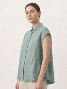 100% linen two-way button blouse with Peter Pan collar and cap sleeves, shown front and back views