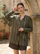 Linen-cotton striped shirt with tassel trim, relaxed fit, drop shoulder, vertical stripes, and braided collar detail