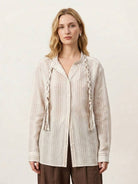 Linen-cotton striped shirt with tassel trim, relaxed fit, and drop shoulder design