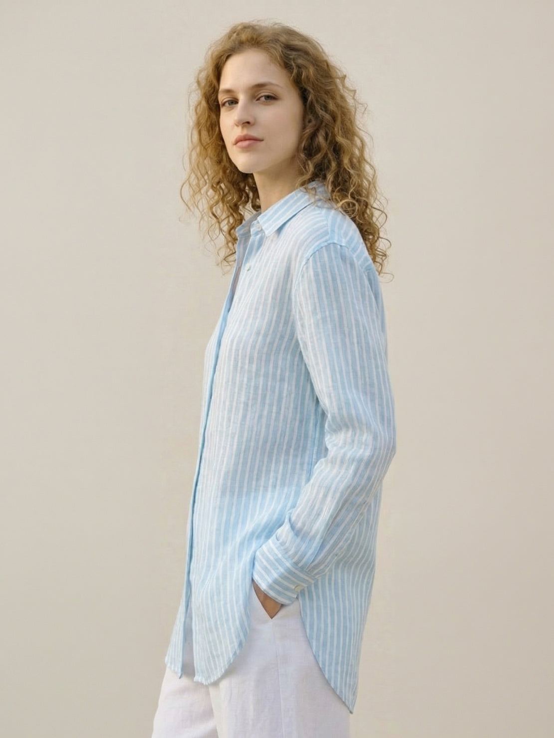 100% linen pinstripe shirt with loose fit, drop shoulders, curved hem, and button cuffs