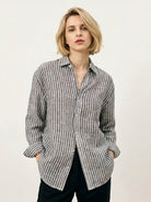 Women's 100% linen pinstripe shirt with loose fit, drop shoulders, and curved hem