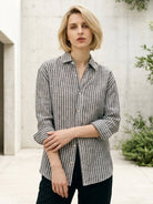 100% linen pinstripe shirt with loose fit, drop shoulders, and curved hem