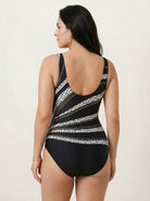 Curve-Fit open-back swimsuit with scoop front, adjustable straps, and diagonal back panels for structured fit