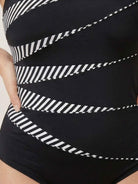 Curve-fit open-back swimsuit with scoop front, adjustable straps, and diagonal back panels in black polyester.