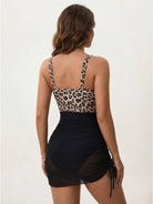 Close-up of tummy control mesh swim dress with deep V-neck and adjustable straps