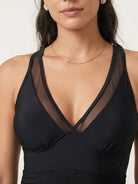 Tummy control mesh swim dress with deep V-neck, ruching waist, adjustable racerback straps, and side drawstring hemline.