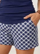 High-neck ruched tankini set with gathered side seams and built-in brief, ideal for swimming and beachwear.