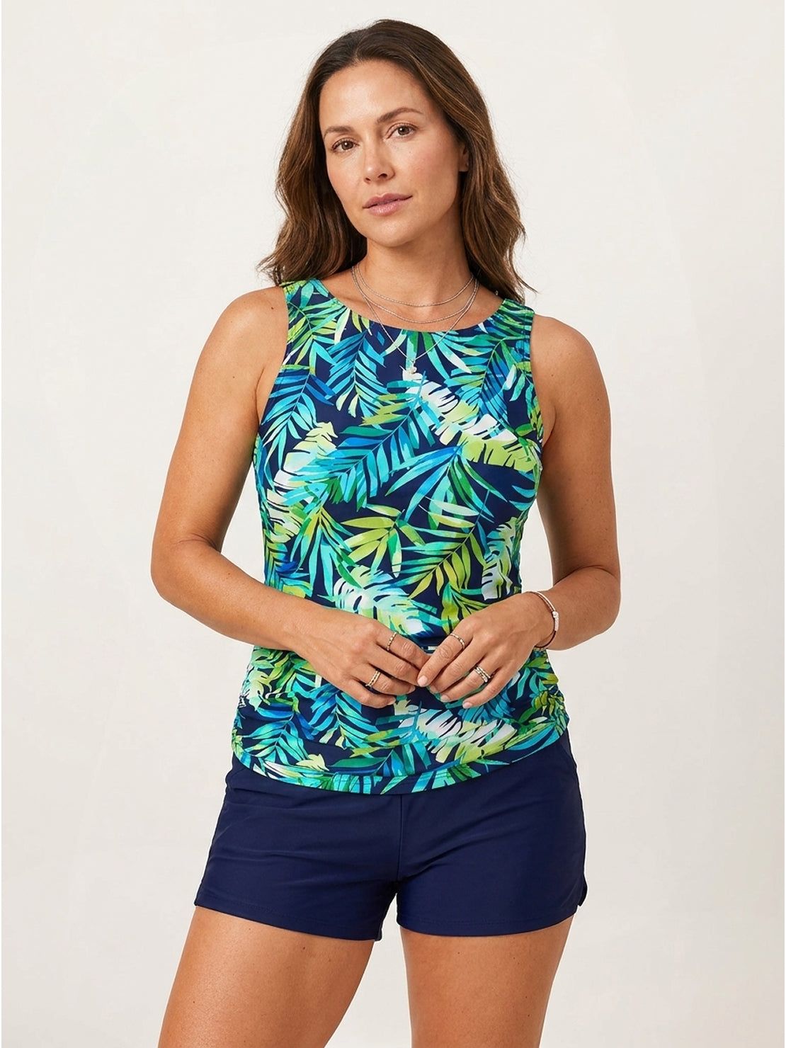 High-neck ruched tankini set with gathered sides, wide tank straps, and built-in brief swimwear.