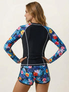 Long-sleeve UV rash guard set with tropical print sleeves and matching swim shorts