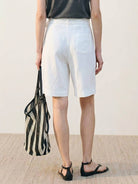 white linen belted shorts with high-rise waist and wide-leg fit