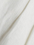 white 100% linen belted shorts with high-rise waist and relaxed wide-leg fit