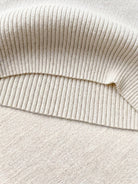 knit vest with attached scarf in soft fine ribbed knit and sleeveless design