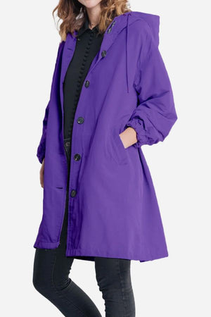 Water-resistant oversized purple hooded windbreaker jacket with button front and pockets