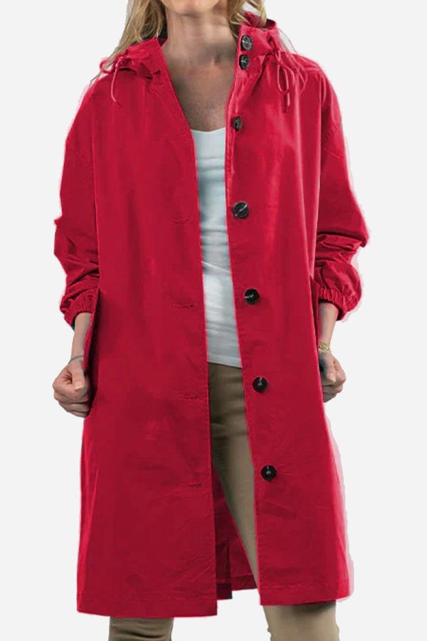 Red oversized water-resistant windbreaker jacket with hood and button closure