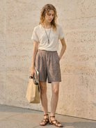 100% linen rolled cuff tee with relaxed scoop neckline and contrast inner lining